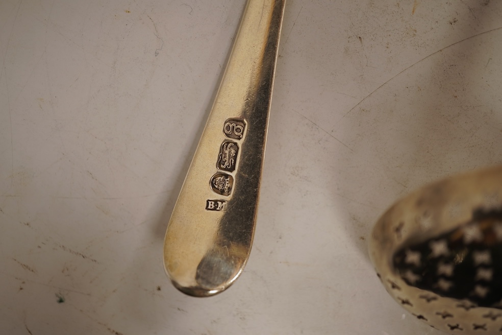 A George III silver fiddle pattern stilton scoop, John Lias, London, 1816, 20cm, together with two Georgian silver sauce ladles, a similar sifter ladle and a William IV shell pattern fish knife, 8.9oz.